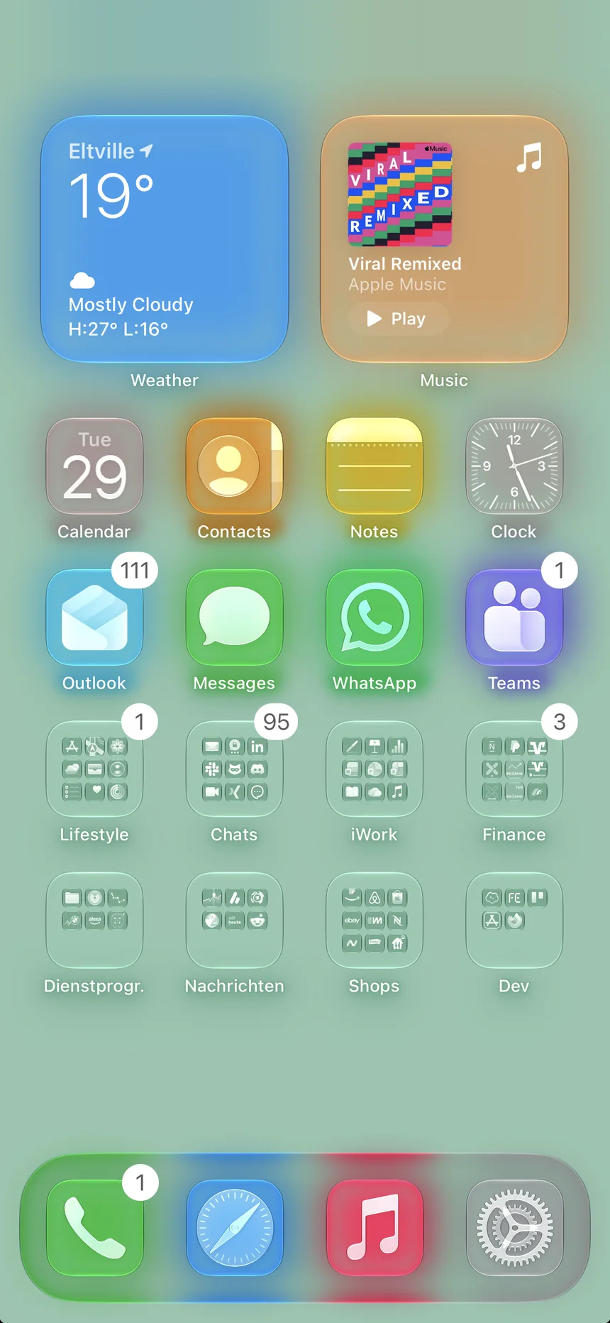 Home Screen with a soft mint wallpaper and pastel glows